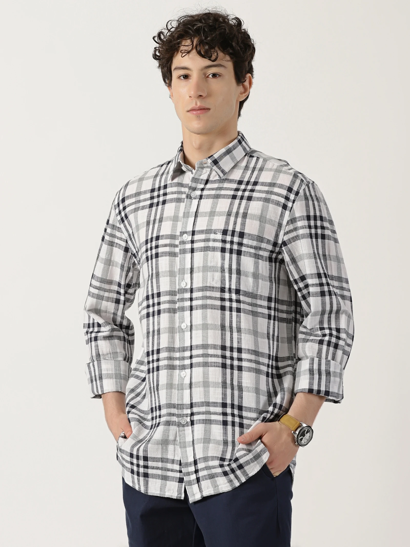 white shirt featuring a combination of black and green check lines
